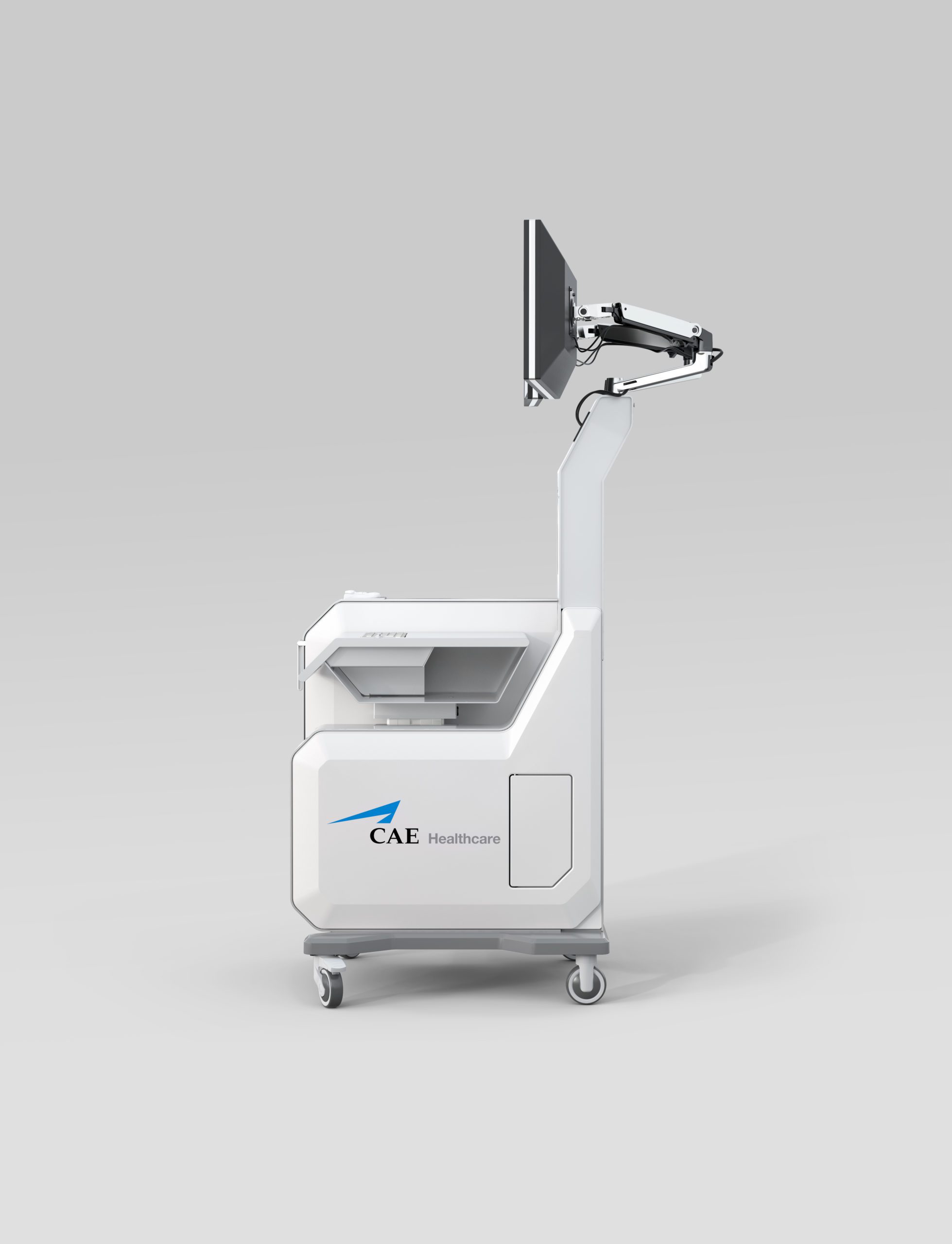 A mobile medical device with a screen on an adjustable arm, white body, and wheels, branded with the CAE Healthcare logo—designed by an agence de développement de produits médicaux au Canada—displayed against a plain light gray background.