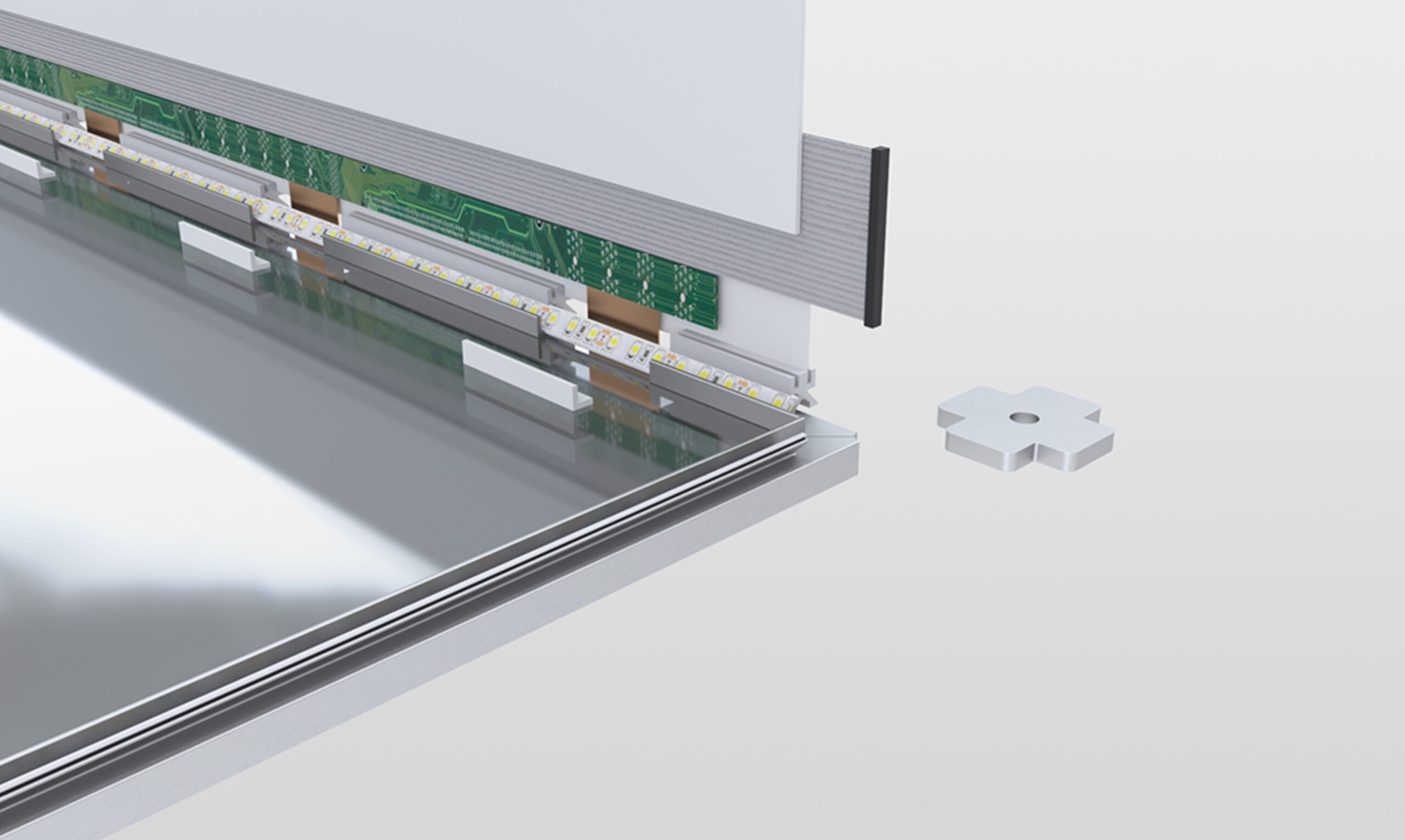 Close-up of an electronic device being assembled, showing a circuit board, LED strip, and metallic frame—perfect for an agence de développement de produits au Canada—with a small, white, star-shaped part placed nearby on a white surface.