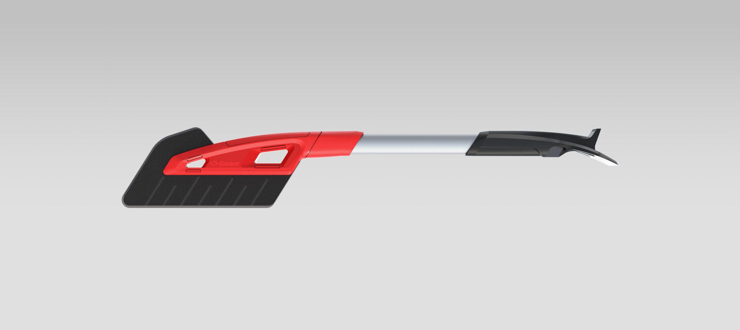 Une brosse à neige avec une tête de brosse plate et large de couleur noire, un manche rouge et argenté et un grattoir à glace noir à l'autre extrémité - fabriquée par une agence d'ingénierie mécanique à Montréal - sur un fond gris clair uni.